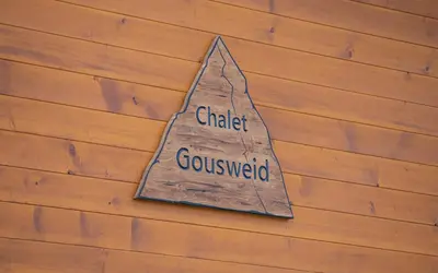 Ein Zertifikat, Auszeichnung, Logo oder anderes Dokument, das in der Unterkunft Mönch Apartment - Aare Jungfrau AG ausgestellt ist