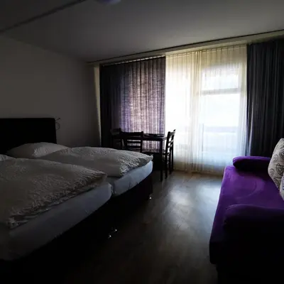 Ein Bett oder Betten in einem Zimmer der Unterkunft Hotel Crystal