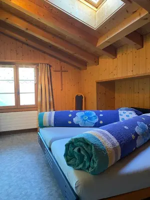 Ein Bett oder Betten in einem Zimmer der Unterkunft Ferienwohnung Stalden