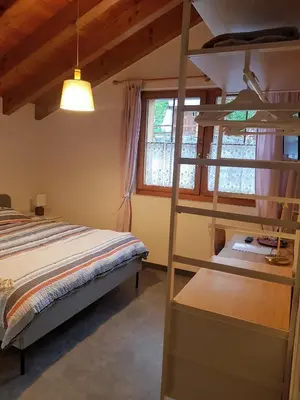 Ein Bett oder Betten in einem Zimmer der Unterkunft Hotel Beau-Séjour