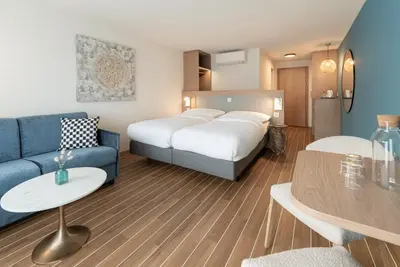 Ein Bett oder Betten in einem Zimmer der Unterkunft Hotel-Restaurant Seegarten-Marina
