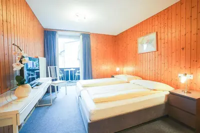 Ein Bett oder Betten in einem Zimmer der Unterkunft Hotel Landhaus Adler