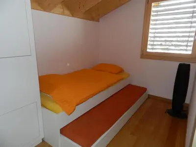 Ein Bett oder Betten in einem Zimmer der Unterkunft Apartment Gletscherblick- Chalet by Interhome