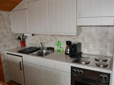 Küche/Küchenzeile in der Unterkunft Apartment Résidence Sonnegg - Herrli by Interhome