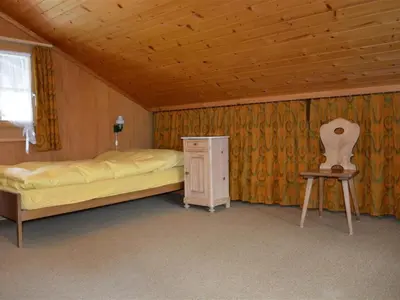 Ein Bett oder Betten in einem Zimmer der Unterkunft Apartment Marmotte- Chalet by Interhome