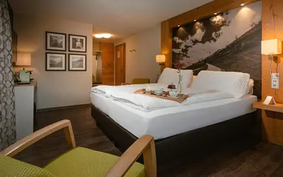 Ein Bett oder Betten in einem Zimmer der Unterkunft Hotel Landhaus
