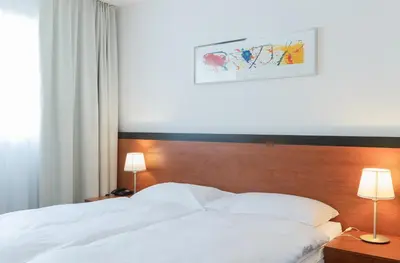 Ein Bett oder Betten in einem Zimmer der Unterkunft Motel Gottardo Sud