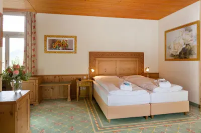 Ein Bett oder Betten in einem Zimmer der Unterkunft Sporthotel Wildstrubel