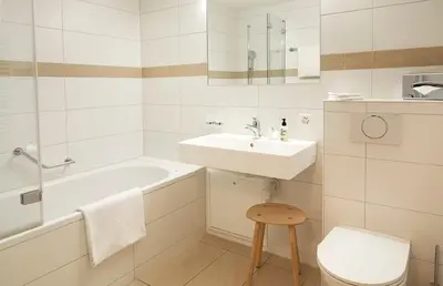 Ein Badezimmer in der Unterkunft Hotel Alpenland