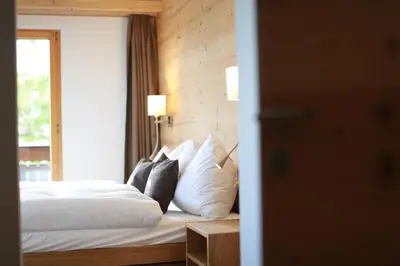 Ein Bett oder Betten in einem Zimmer der Unterkunft Hotel Bettmerhof
