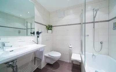 Ein Badezimmer in der Unterkunft Hotel Excelsior