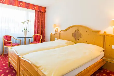 Ein Bett oder Betten in einem Zimmer der Unterkunft Hotel Excelsior