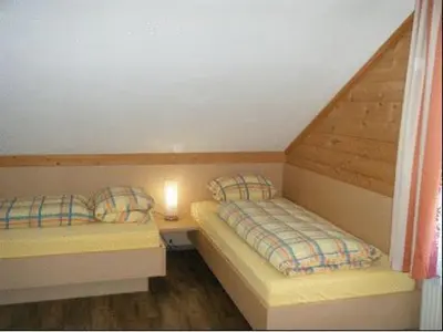 Ein Bett oder Betten in einem Zimmer der Unterkunft Hotel Des Alpes