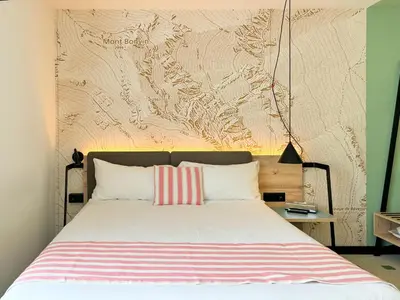 Ein Bett oder Betten in einem Zimmer der Unterkunft Nonanteneuf appart hōtel Sierre - contactless check-in