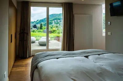 Ein Bett oder Betten in einem Zimmer der Unterkunft Hotel Seepark Thun