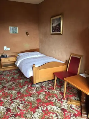 Ein Bett oder Betten in einem Zimmer der Unterkunft Hotel Belmont