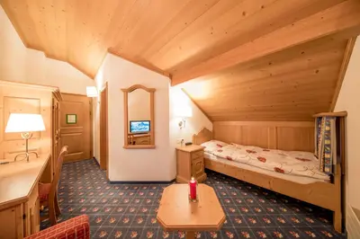 Ein Bett oder Betten in einem Zimmer der Unterkunft Hotel Alpbach