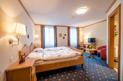 Ein Bett oder Betten in einem Zimmer der Unterkunft Hotel Alpbach