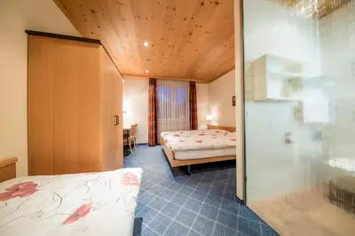 Ein Bett oder Betten in einem Zimmer der Unterkunft Hotel Alpbach