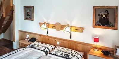 Ein Bett oder Betten in einem Zimmer der Unterkunft Hotel La Cambuse