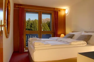 Ein Bett oder Betten in einem Zimmer der Unterkunft Aparthotel Ambassador