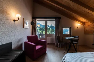 Ein Bett oder Betten in einem Zimmer der Unterkunft Hotel Maya Caprice