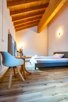 Ein Bett oder Betten in einem Zimmer der Unterkunft Hotel Restaurant Simplon
