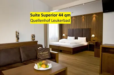 Ein Bett oder Betten in einem Zimmer der Unterkunft Hotel Quellenhof Leukerbad