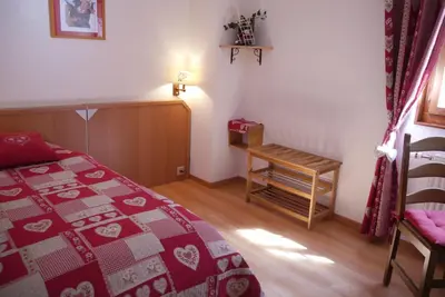Ein Bett oder Betten in einem Zimmer der Unterkunft Hotel Les Mélèzes