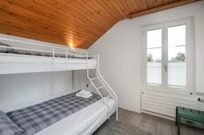 Ein Bett oder Betten in einem Zimmer der Unterkunft Interlaken Apartments