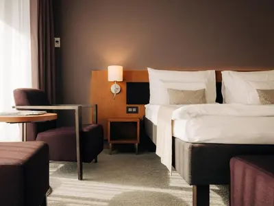 Ein Bett oder Betten in einem Zimmer der Unterkunft Deltapark Vitalresort****