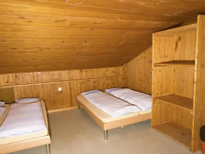Ein Bett oder Betten in einem Zimmer der Unterkunft Hotel Aletschhorn