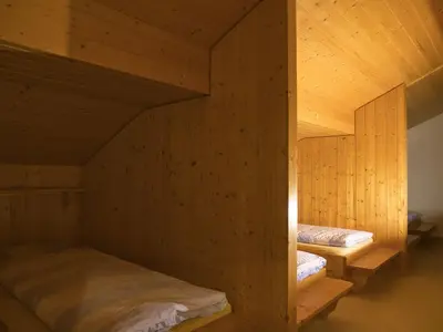 Ein Bett oder Betten in einem Zimmer der Unterkunft Hotel Aletschhorn