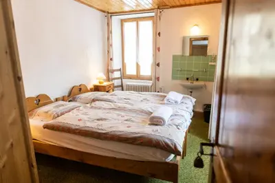 Ein Bett oder Betten in einem Zimmer der Unterkunft Aiguille de La Tza