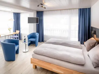 Ein Bett oder Betten in einem Zimmer der Unterkunft Hotel Alpha