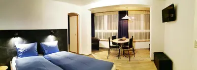 Ein Bett oder Betten in einem Zimmer der Unterkunft Hotel Alpha