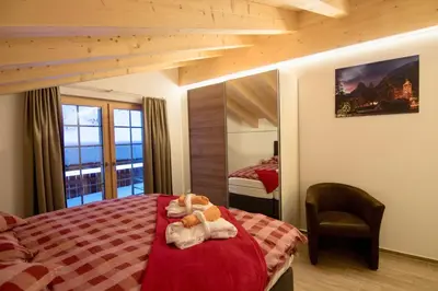 Ein Bett oder Betten in einem Zimmer der Unterkunft Element Chalets Zermatt