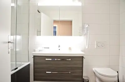 Ein Badezimmer in der Unterkunft Apartment Flüehblüemli - GRIWA RENT AG