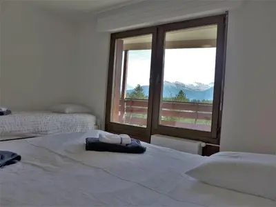Ein Bett oder Betten in einem Zimmer der Unterkunft Apartment Monte Cristo 6 by Interhome