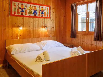 Ein Bett oder Betten in einem Zimmer der Unterkunft Chalet Coquelicot by Interhome