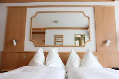 Ein Bett oder Betten in einem Zimmer der Unterkunft Hotel und Appartments Eden