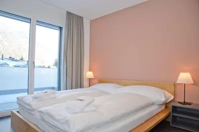 Ein Bett oder Betten in einem Zimmer der Unterkunft Apartment Anemone - GRIWA RENT AG
