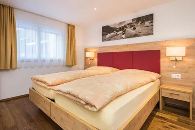 Ein Bett oder Betten in einem Zimmer der Unterkunft Ferienhaus Matterhorngruss