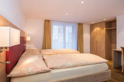Ein Bett oder Betten in einem Zimmer der Unterkunft Ferienhaus Matterhorngruss