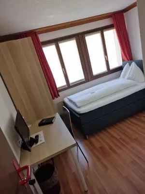 Ein Bett oder Betten in einem Zimmer der Unterkunft Hotel Alpha Thun