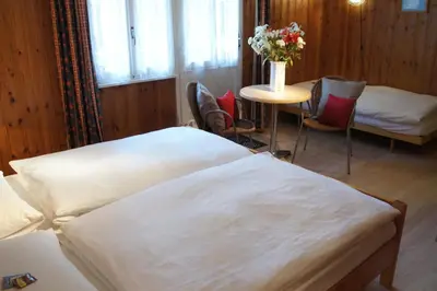 Ein Bett oder Betten in einem Zimmer der Unterkunft Hotel Alpina