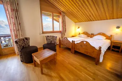 Ein Bett oder Betten in einem Zimmer der Unterkunft Hôtel Magrappé