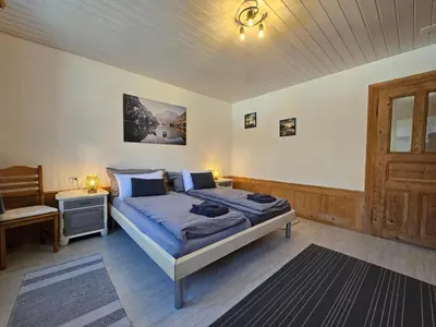 Ein Bett oder Betten in einem Zimmer der Unterkunft Mountain Holiday
