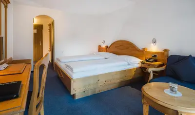 Ein Bett oder Betten in einem Zimmer der Unterkunft Walliserhof