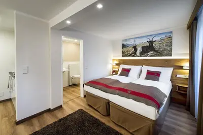 Ein Bett oder Betten in einem Zimmer der Unterkunft Apartments Butterfly Zermatt